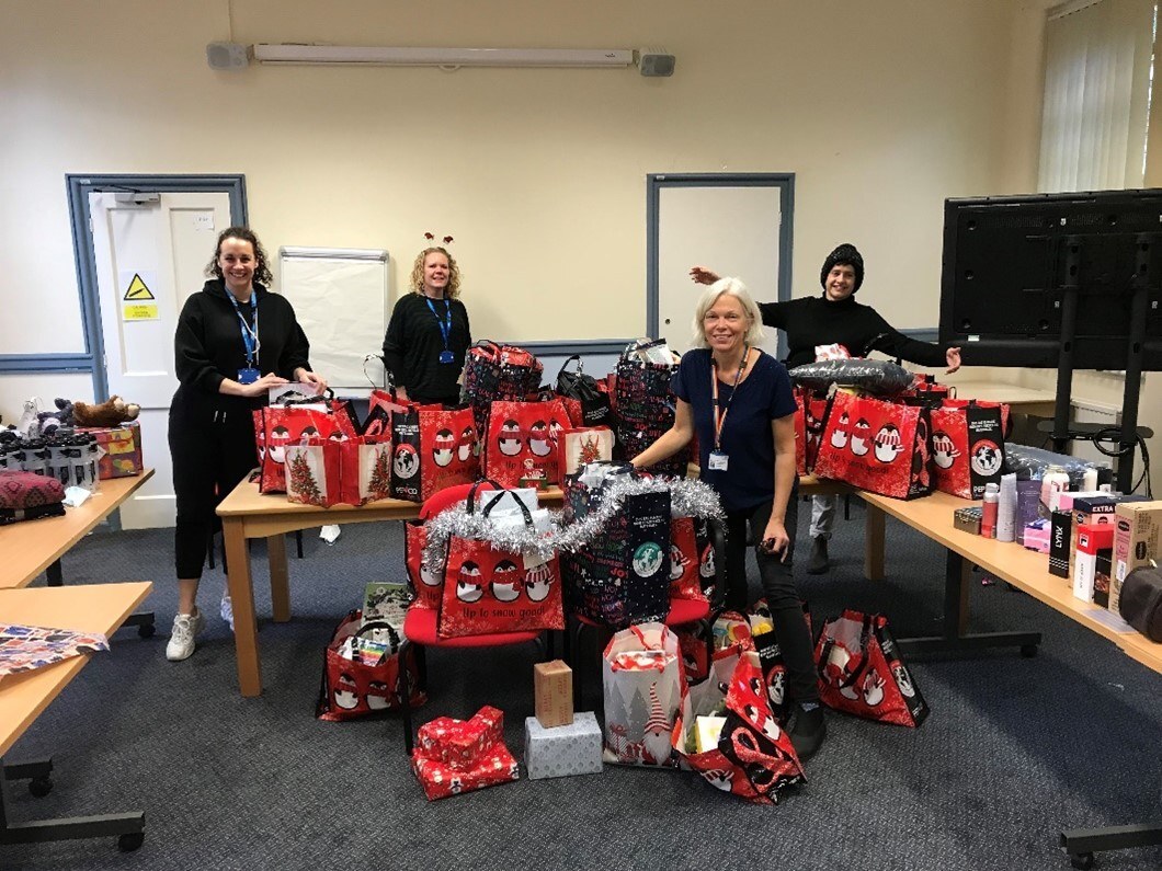 New Leaf Staff with bags of Christmas presents