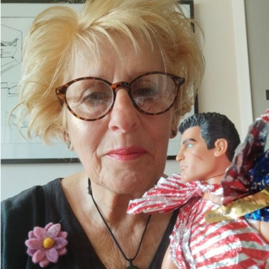 Pictured above: Julie Fisher with an exhibit from her Foil Alchemy collection. Julie Fisher with an exhibit from her Foil Alchemy collection.